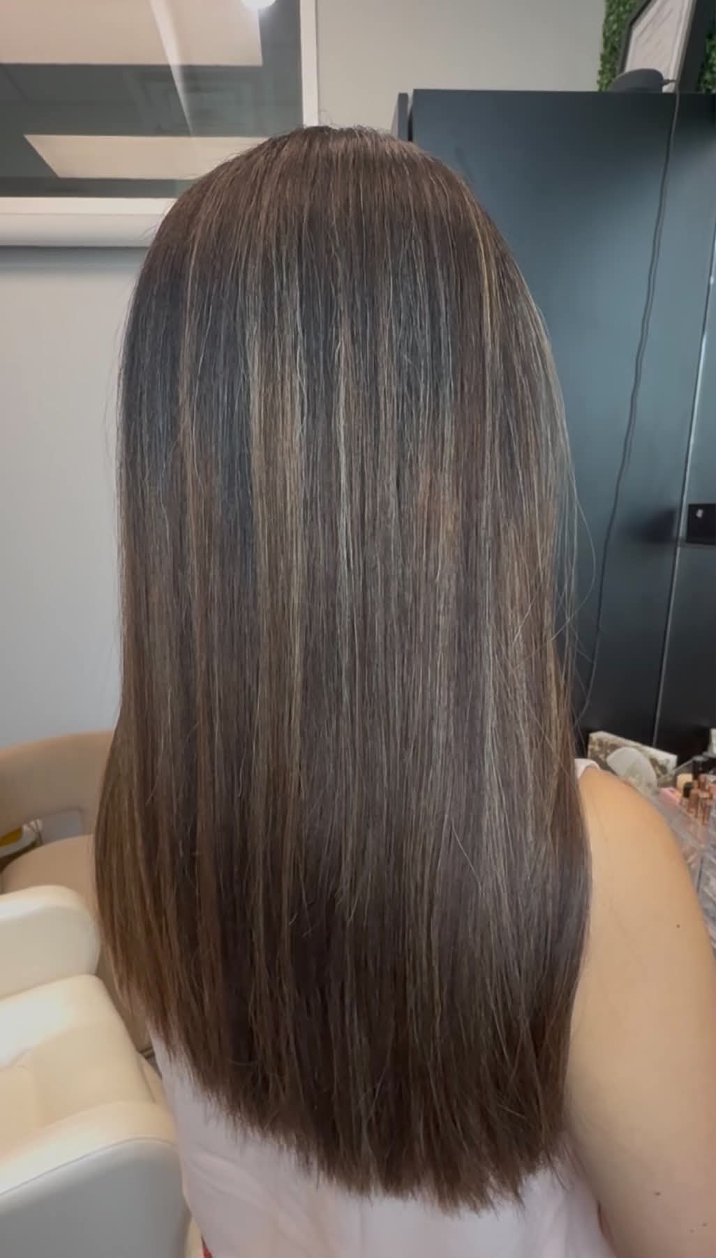 Long polished brunette hair with subtle tonal dimension