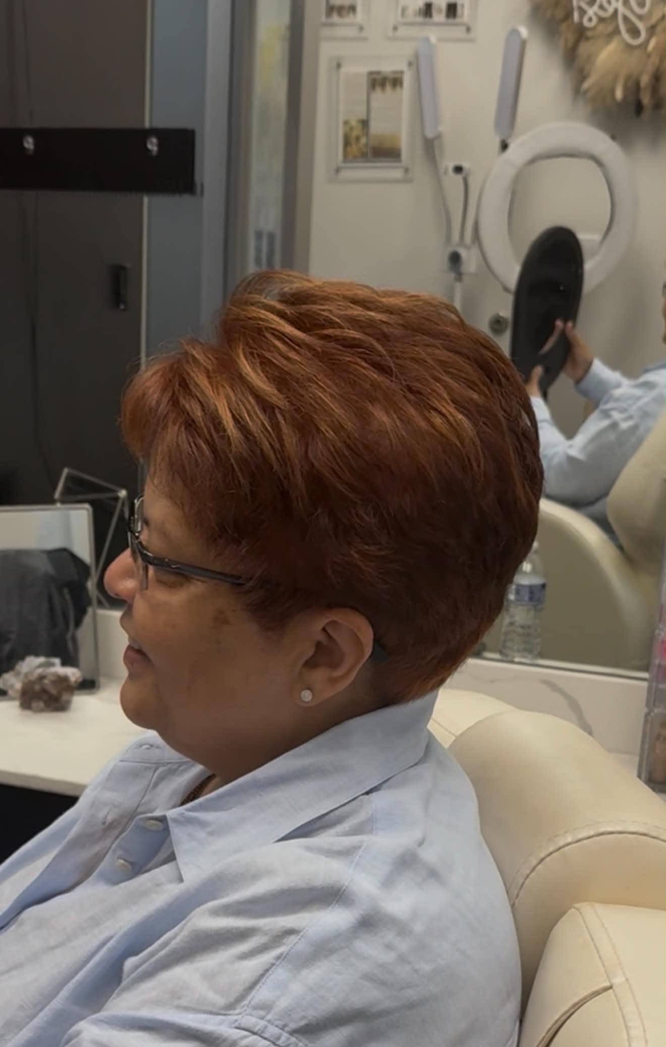 Short copper pixie haircut with softly sculpted volume