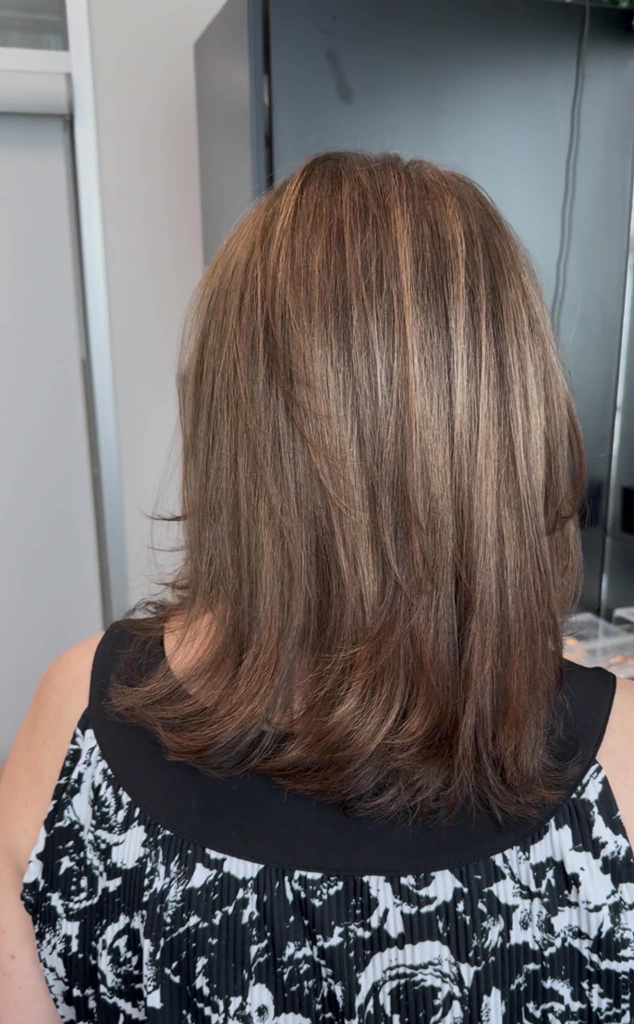 Shoulder-length brunette cut with softly beveled ends