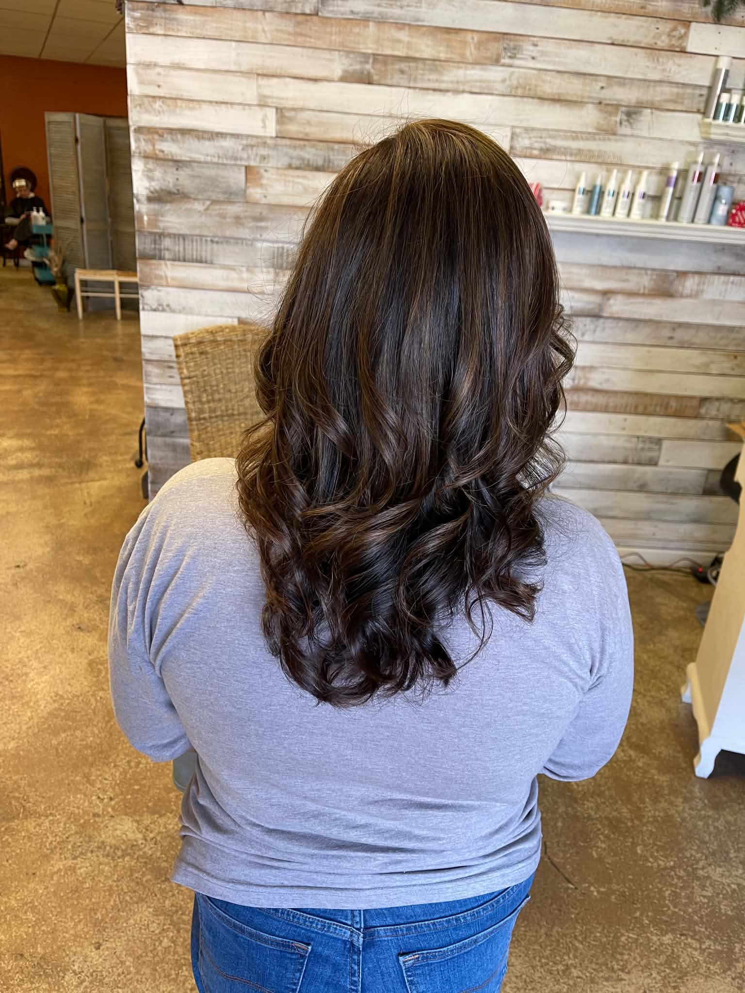 Rich brunette color finished with polished curls